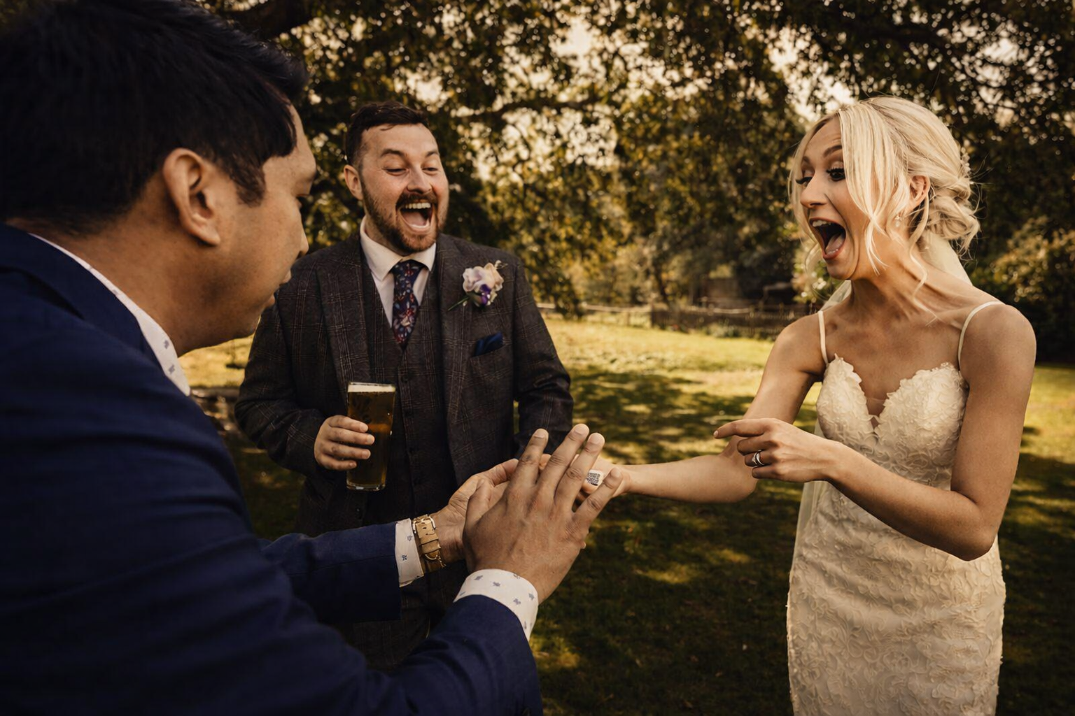 Wedding magician performing close-up magic for a bride at a wedding
